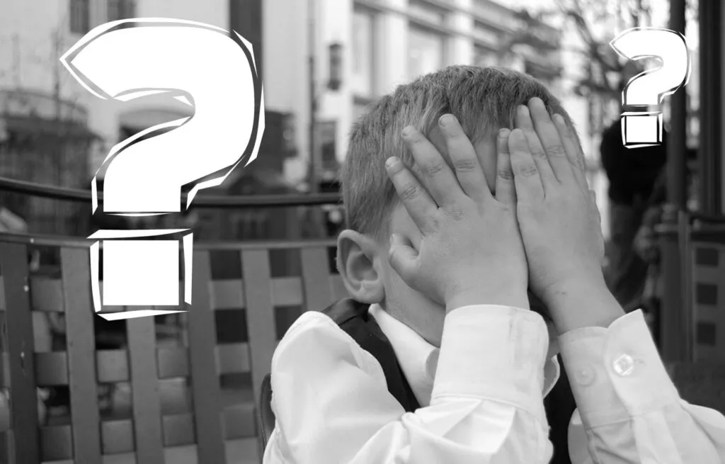 Little Boy With Hands on His Face