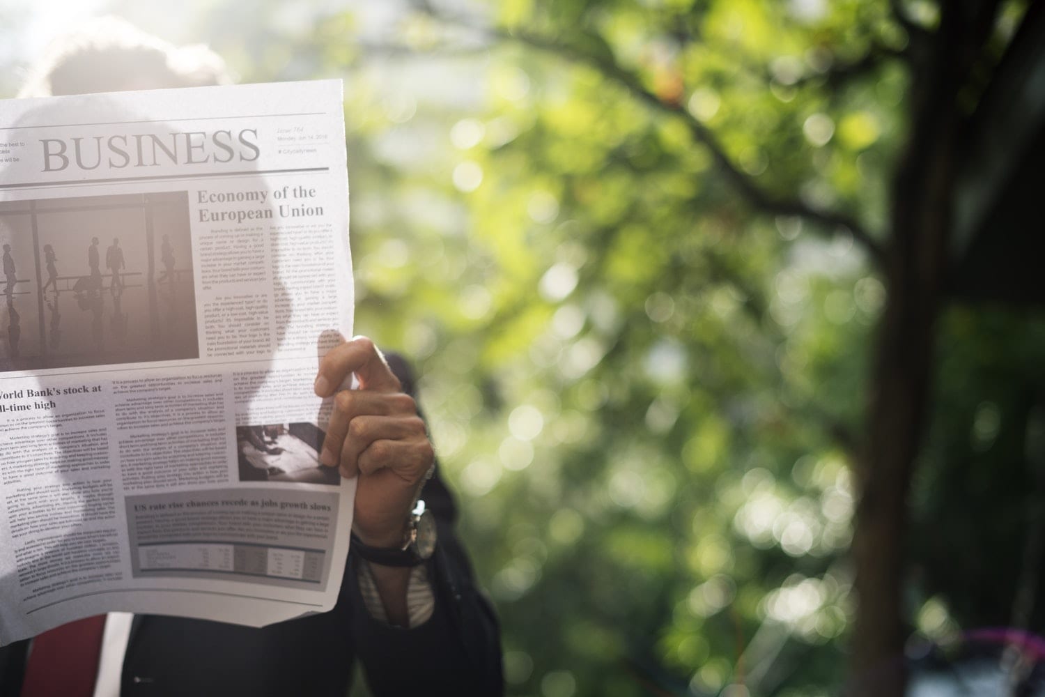 Man holding newspaper