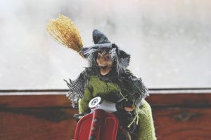 Toy witch with broom