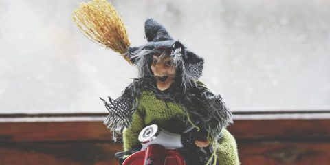 Toy witch with broom